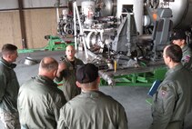 Lt. Col. David Condit, 302nd Airlift Wing chief of safety and Air Force Reserve Command aerial firefighting coordinator, explains to members of a Slovenian air force delegation March 18 the benefits and challenges of operating the Modular Airborne Firefighting System during their visit to Peterson Air Force Base, Colo. The delegation, lead by Slovenian air force Capt. Nikolaj Galesa, was sponsored by the Colorado Air National Guard during their visit to the U.S. and to the 302nd AW at Peterson AFB. The Slovenian airmen also learned about C-130 Hercules operations and the challenges with using the aircraft with the MAFFS mission. (U.S. Air Force photo/Staff Sgt. Stephen J. Collier)