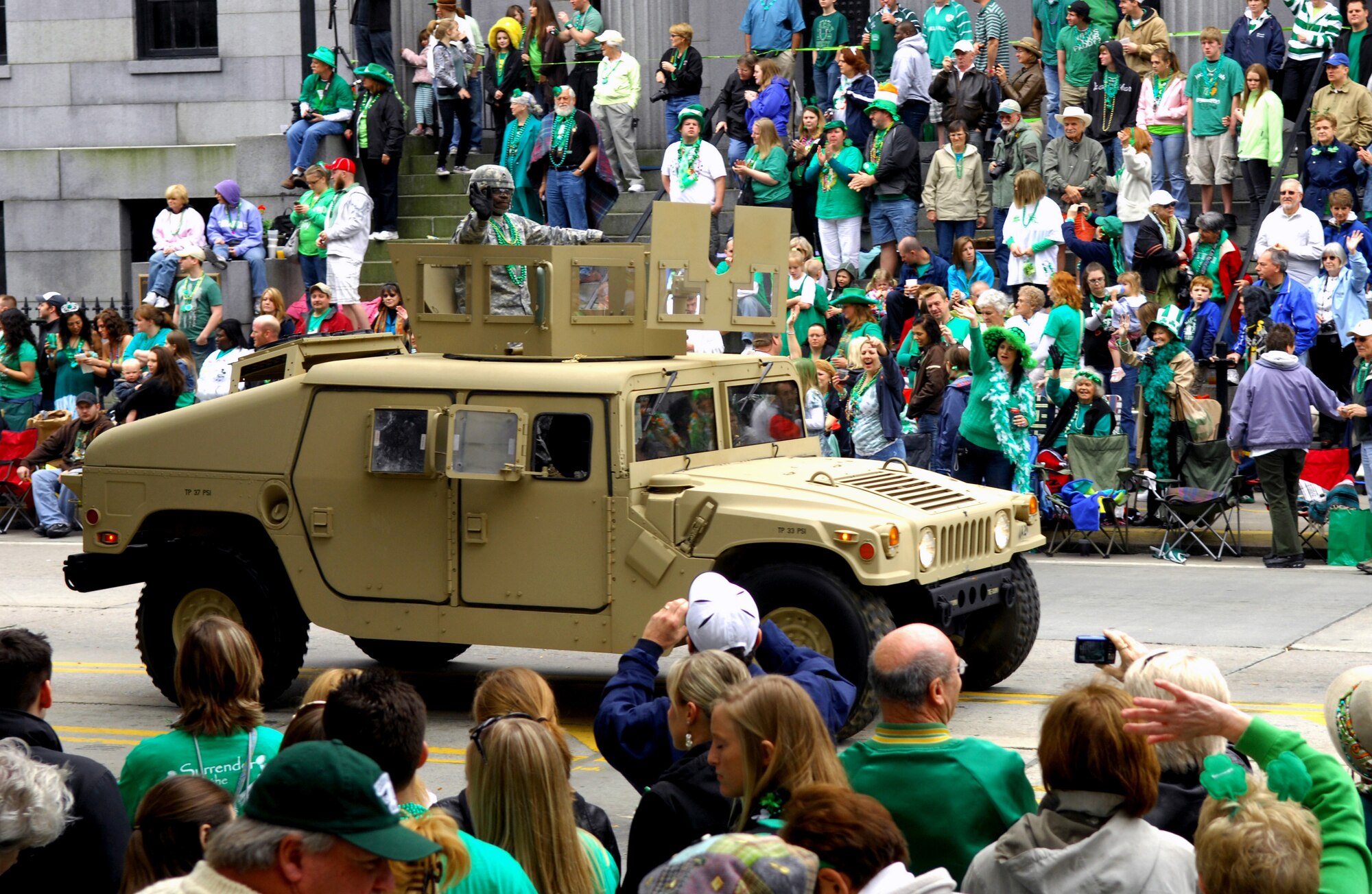 SAVANNAH, Ga. -- A soldier in a high-mobility, multipurpose wheeled vehicle from the 118th Infantry Division at Fort Stewart, Ga. drives down Bay Steet and waves to the spectators at the Savannah, Ga. St. Patrick's Day parade March 17th. Savannah hosts the second largest St. Patrick's Day parade in the nation. Shaw Air Force Base outdoor recreation took members from Team Shaw to the St. Patrick's Day parade. (U.S. Air Force photo/Airman 1st Class Daniel Phelps)