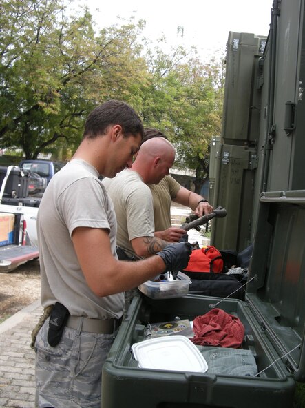 PETIONVILLE, Haiti -- Airman 1st Class Nicholas Imperiale, 823rd Expeditionary Security Forces Squadron, performs a customs inspection here March 7. (U.S. Air Force photo by Senior Airman Jake Pratt)