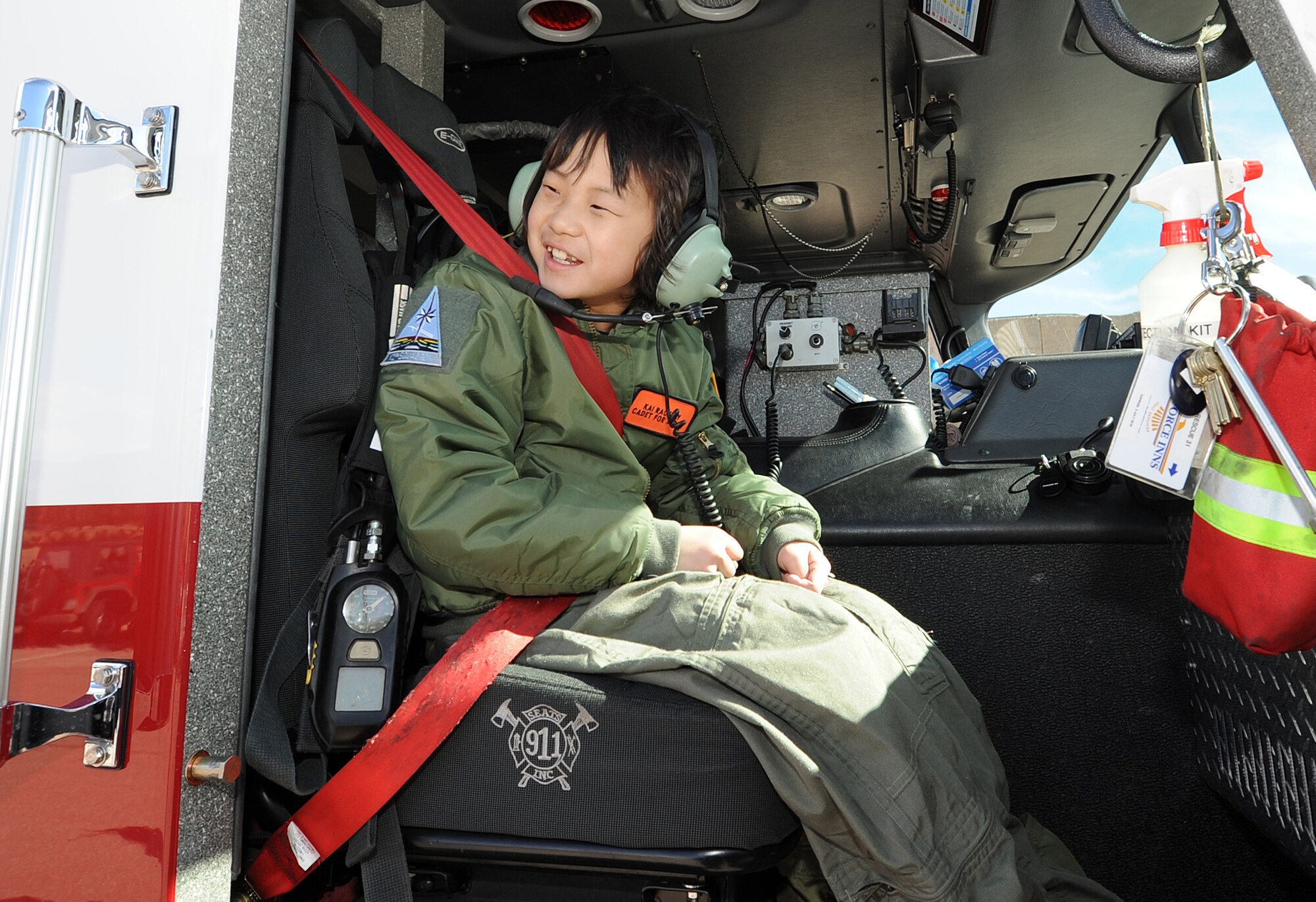 Cadet for a Day Kai Rackley hops into a fire truck near Fire Station 3 at the Air Force Academy March 5, 2010. Kai, who is 10?, was diagnosed with leukemia in 2007 and has been in remission since 2009. The Cadet for a Day program is sponsored by the Make-A-Wish Foundation. (U.S. Air Force photo/Rachel Boettcher)