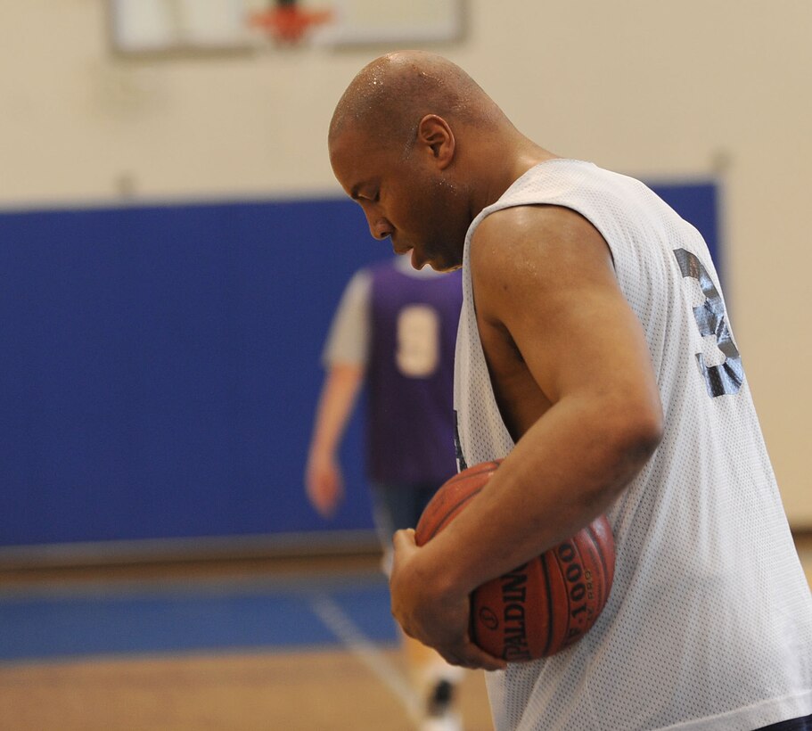 LANGLEY AIR FORCE BASE, Va. -- Chief Master Sgt. Vernon Perry III, Air Combat command A4, takes a break after his team scored against the Eagles in the Chiefs versus Eagles March Madness game March 19. This is the first year the two ranks have competed against each other here at Langley; Chiefs won, 50-38. (U.S. Air Force photo/Airman Rebecca Montez)
