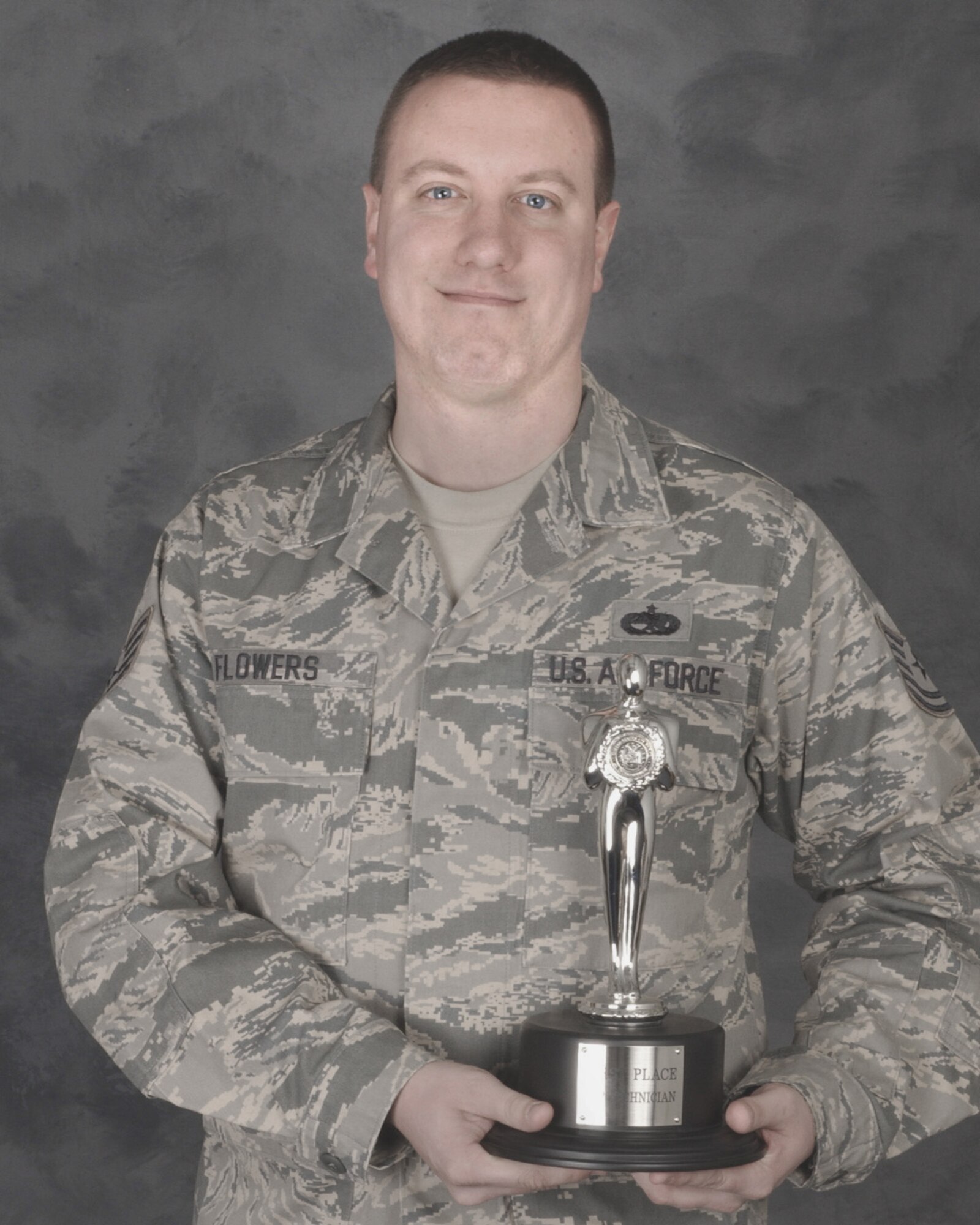 Tech. Sgt. Matthew Flowers pictured with the coveted Roger Award. Sgt. Flowers won the award for top technician during the annual Air Force Worldwide Talent Search held 17-25 January at Lackland AFB, Texas. Sgt Flowers a munitions system technician with the 132nd Fighter Wing, Iowa Air National Guard will be joining Tops In Blue for their 2010 season in March as a result as a result of the competition. Sergeant Flowers will be the groups lighting and technical director.(USAF photo/Senior Master Sgt. Tim Day)(released)                             