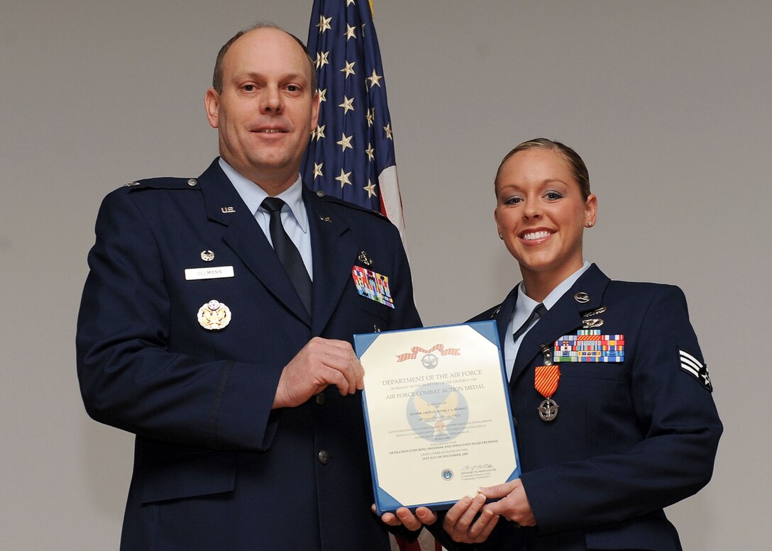 LANGLEY AIR FORCE BASE, Va. -- Senior Airman Jessica Berrio, 633 Civil Engineer Squadron Explosive Ordnance Disposal team, is awarded the Air Force Combat Action Medal here March 19. (U.S. Air Force photo/Airman Rebecca Montez)