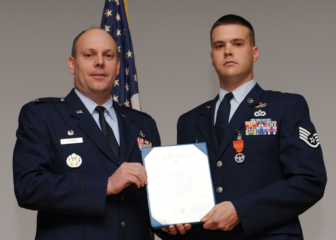 LANGLEY AIR FORCE BASE, Va. -- Staff Sgt. Thomas Becker, 633 Civil Engineer Squadron Explosive Ordnance Disposal team, is awarded the Air Force Combat Action Medal here March 19. (U.S. Air Force photo/Airman Rebecca Montez)