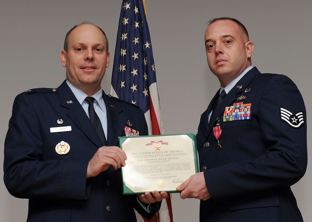 LANGLEY AIR FORCE BASE, Va. -- Staff Sgt. Blake Lundstrom, 633 Civil Engineer Squadron Explosive Ordnance Disposal team, is awarded the Bronze Star Medal here March 19. (U.S. Air Force photo/Airman Rebecca Montez)