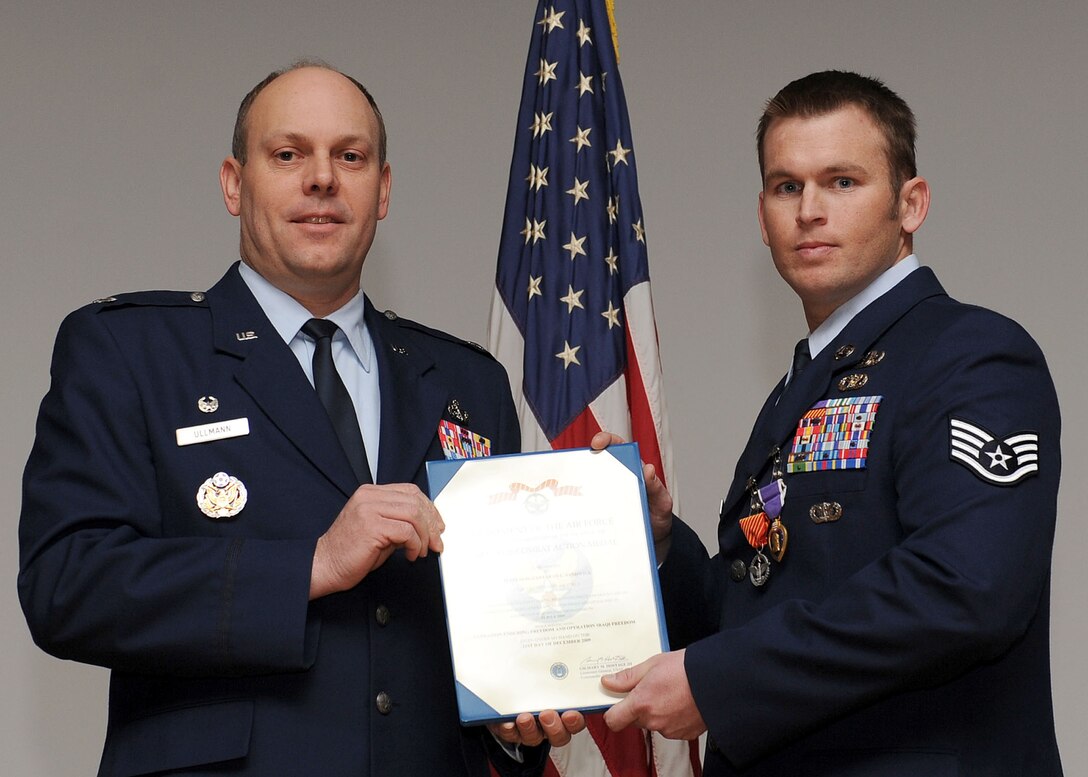 LANGLEY AIR FORCE BASE, Va. -- Staff Sgt. Sean Sandwick, 633 Civil Engineer Squadron Explosive Ordnance Disposal team, is awarded the Air Force Combat Action Medal here March 19. Sandwick also received the Purple Heart. (U.S. Air Force photo/Airman Rebecca Montez)