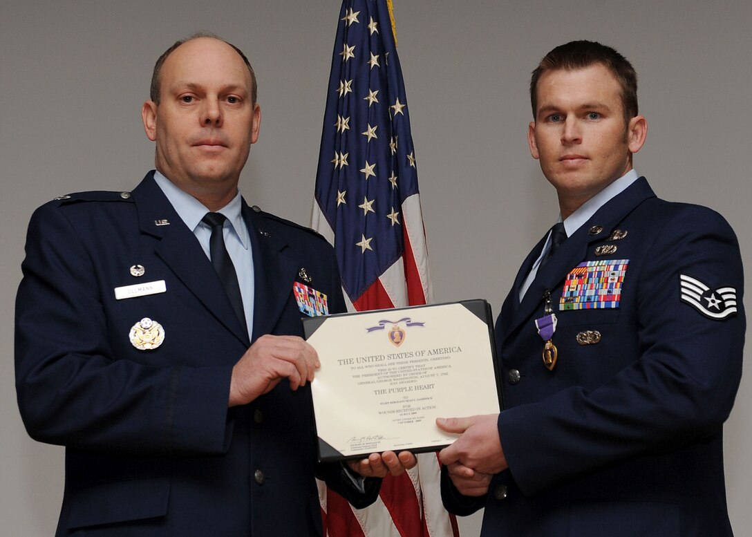 LANGLEY AIR FORCE BASE, Va. -- Staff Sgt. Sean Sandwick, 633 Civil Engineer Squadron Explosive Ordnance Disposal team, is awarded the Purple Heart here March 19. (U.S. Air Force photo/Airman Rebecca Montez)