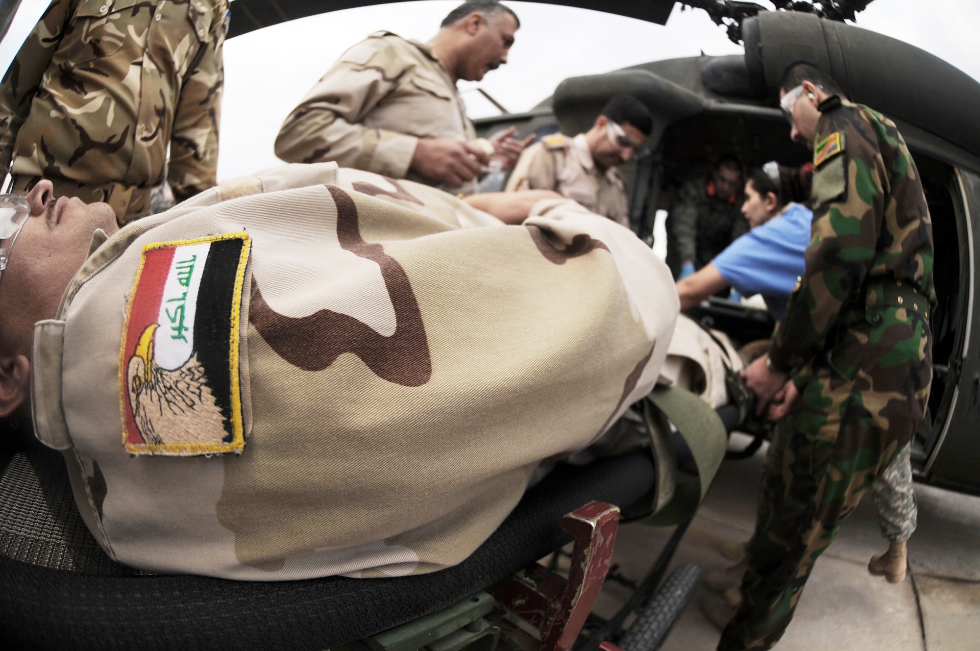 Iraqi air force members put their skills to the test during medical evacuation training Dec. 21, 2009, at the Air Force Theater Hospital at Joint Base Balad, Iraq. The purpose of the training is to help the Ministry of Defense strengthen its health care system for Iraqi troops. (U.S. Air Force photo/Senior Airman Brittany Y. Bateman)