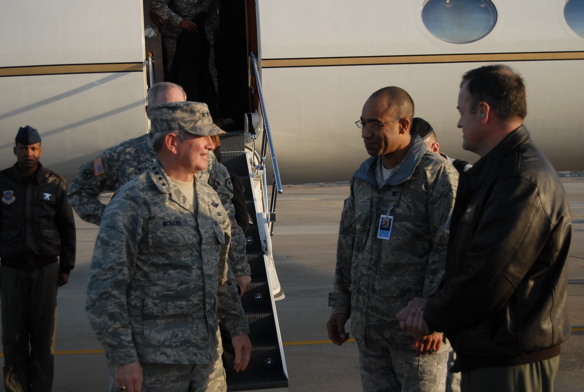Gen. Duncan McNabb, (left) U.S. Transportation Command Commander is welcomed to Pope by  Col. James Johnson, 43rd Airlift Wing Commander and Merle Hart, 440th Airlift Wing Commander  on Jan. 28. (U.S. Air Force photo/Senior Airman Kris Levasseur)