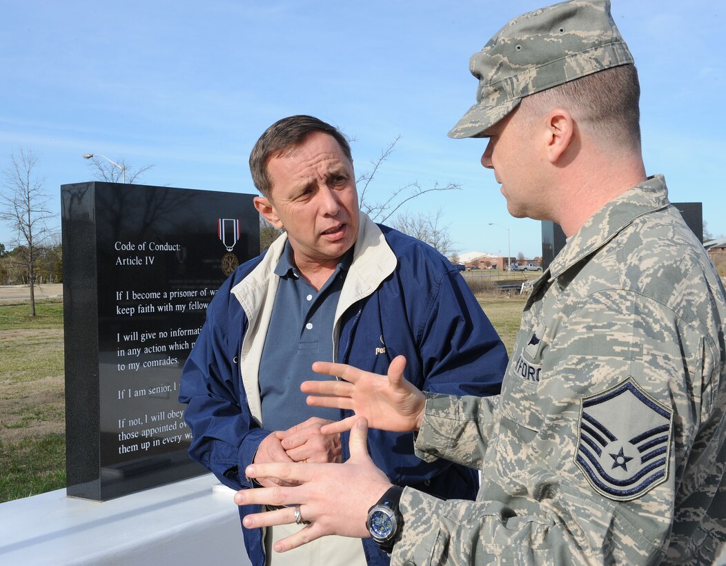 LANGLEY AIR FORCE BASE, Va. -- Master Sgt. Robert Casagrande, Air Force Sergeants Association Chapter 358 president, explains the symbolism of the recently-erected Prisoner of War/Missing in Action Memorial to retired Chief Master Sgt. of the Air Force Frederick J. Finch during his tour here March 17. Finch spent time touring new facilities and interacting with Airmen during his visit.  (U.S. Air Force photo/Airman Rebecca Montez)
