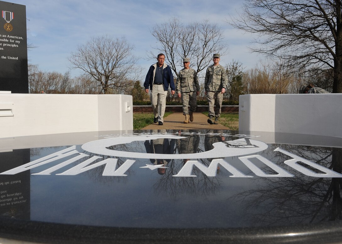 LANGLEY AIR FORCE BASE, Va. -- Retired Chief Master Sgt. of the Air Force Frederick J. Finch, Chief Master Sgt. Charles Anderson, 633d Air Base Wing command chief, and Master Sgt. Robert Casagrande, Air Force Sergeants Association Chapter 358 president, walk into the Prisoner of War/Missing in Action Memorial March 17. Finch spent time touring new facilities and interacting with Airmen during his visit.  (U.S. Air Force photo/Airman Rebecca Montez)