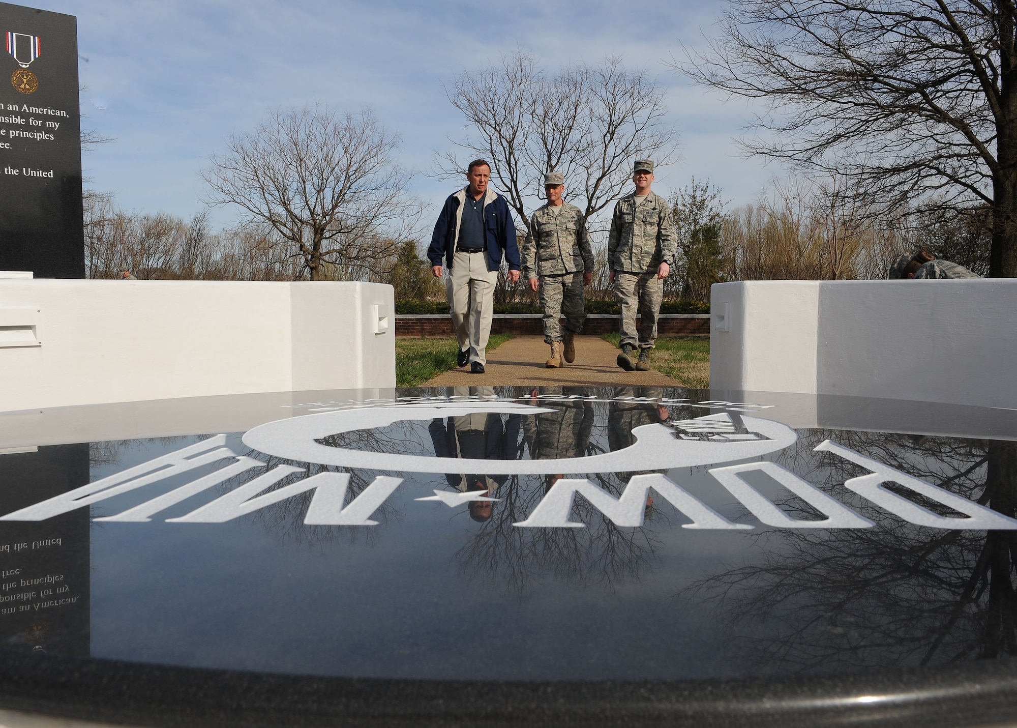 LANGLEY AIR FORCE BASE, Va. -- Retired Chief Master Sgt. of the Air Force Frederick J. Finch, Chief Master Sgt. Charles Anderson, 633d Air Base Wing command chief, and Master Sgt. Robert Casagrande, Air Force Sergeants Association Chapter 358 president, walk into the Prisoner of War/Missing in Action Memorial March 17. Finch spent time touring new facilities and interacting with Airmen during his visit.  (U.S. Air Force photo/Airman Rebecca Montez)