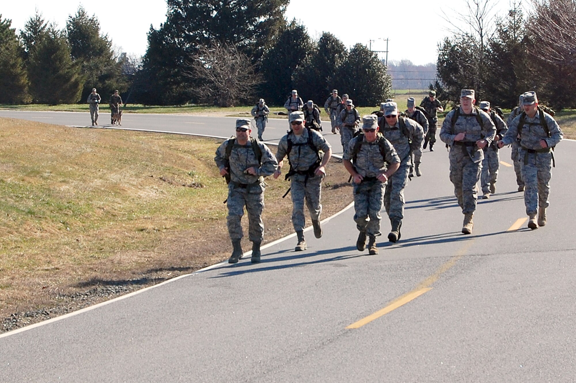 Members from the Air Force Mortuary Affairs Operations Center here participate in the 436th Security Forces Squadron's 11th Annual Ruck March held March 20. The annual 6.2 mile march is a fundraiser to honor the veterans of the Korean War who fought in the Battle of the Chosin Reservoir. (U.S. Air Force photo/Master Sgt. Robert Snyder)