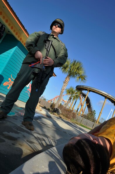 VALDOSTA, Ga. -- Clinton Thornburg, Lowndes County Sherriff’s Office special response team member, awaits medical response personnel during a disaster drill held at Wild Adventures Water and Theme Park here March 15. In order to protect both guests and team members while at the park, the drill reacted to a simulated situation. South Georgia Medical Center Mobile Health Care Service, Lowndes County Sheriff's Department, Lowndes County emergency dispatch and Moody Air Force Base, Ga., participated in this drill.  (U.S. Air Force photo by Staff Sgt. Schelli Jones/Released)