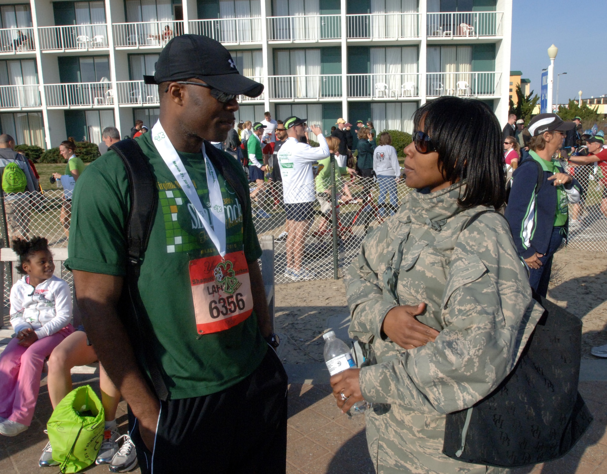 VIRGINIA BEACH, Va. -- Tech. Sgt. Lafonza Spencer, 1st Maintenance Operations Squadron, jokes with his wife, Staff Sgt. Lisette Spencer, 1st Fighter Wing command chief's assistant, after finishing the Yuengling Shamrock Half-Marathon March 21. The team finished third place out of military teams competing in the race. (U.S. Air Force photo/Airman 1st Class Jason J. Brown)