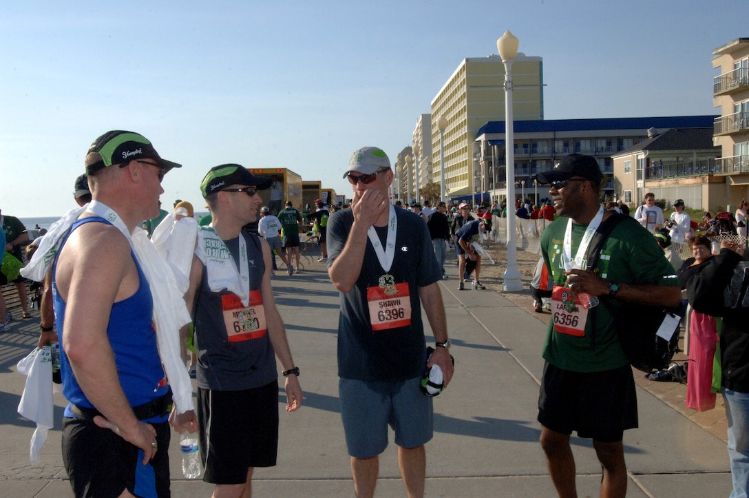 VIRGINIA BEACH, Va. -- Members of the Saber Chargers team talk after finishing the Yuengling Shamrock Half-Marathon March 21. The team finished third place out of military teams competing in the race. (U.S. Air Force photo/Airman 1st Class Jason J. Brown)