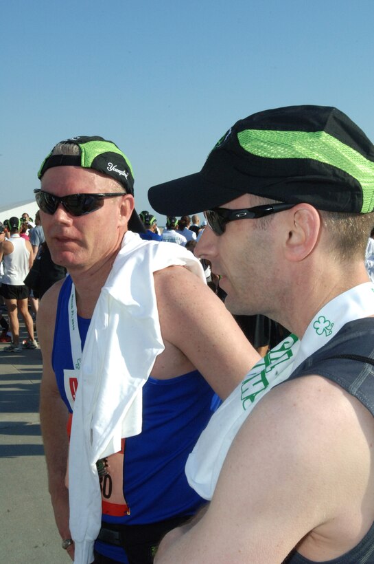 VIRGINIA BEACH, Va. -- Col. George Zaniewski, 1st Maintenance Group commander, talks to Master Sgt. Michael Sanger, 1st Maintenance Operations Squadron, after finishing the Yuengling Shamrock Half-Marathon March 21. Zaniewski said weather conditions and strong camaraderie made the event a success. (U.S. Air Force photo/Airman 1st Class Jason J. Brown)