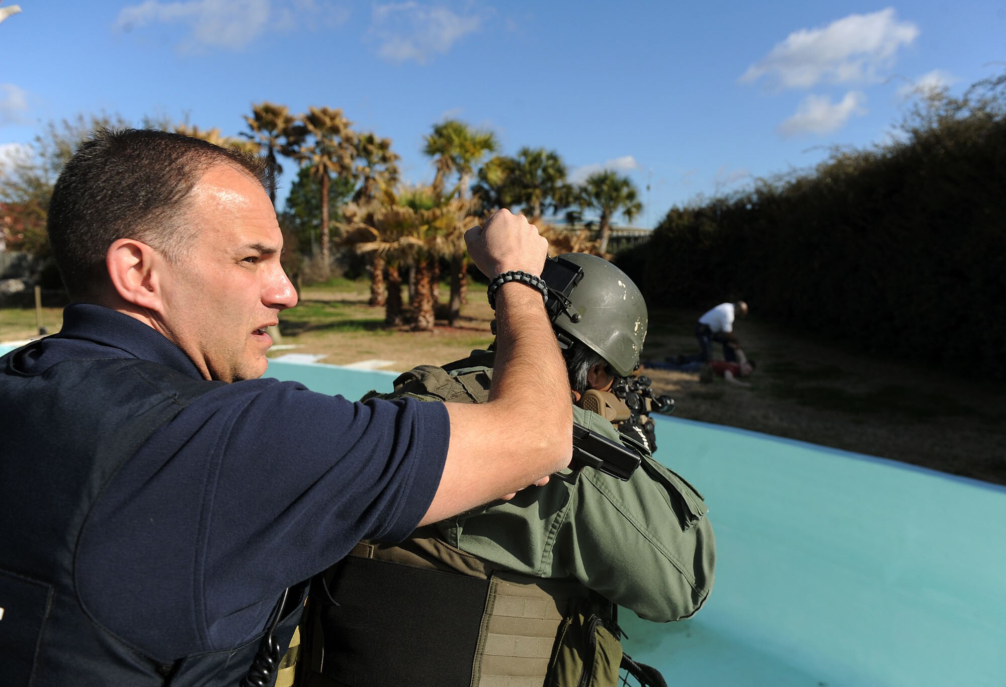 VALDOSTA, Ga. -- Casey Cop, Lowndes County deputy, provides backup for a team member while an irate civilian is apprehended due to his lack of ability to follow orders during a Lowndes County disaster drill held at Wild Adventures Water and Theme Park here March 15. All Airmen and family members involved in the exercise were given certain roles to play, giving the Lowndes County Sheriff’s office members a realistic situation. (U.S. Air Force photo by Airman 1st Class Joshua Green/Released)  
