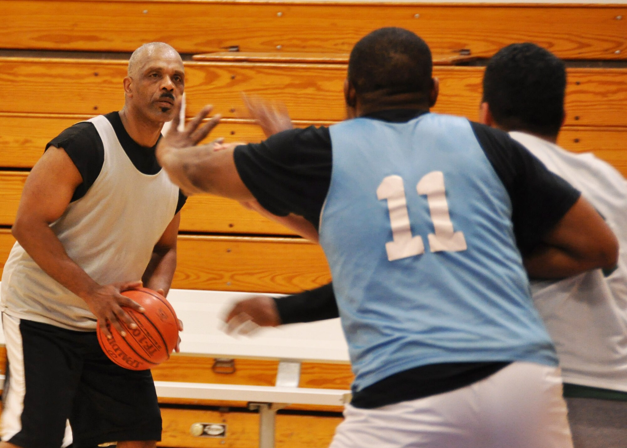 EGLIN AIR FORCE BASE, Fla. – Jimmy Howard, 96th Medical Group coach, looks for an open player during the 2010 Eglin Intramural Basketball Championship in the fitness center, March 17. The 96th Medical Group was crowned champions after beating LRS, 61-55. (U.S. Air Force photo/ Airman 1st Class Anthony Jennings)