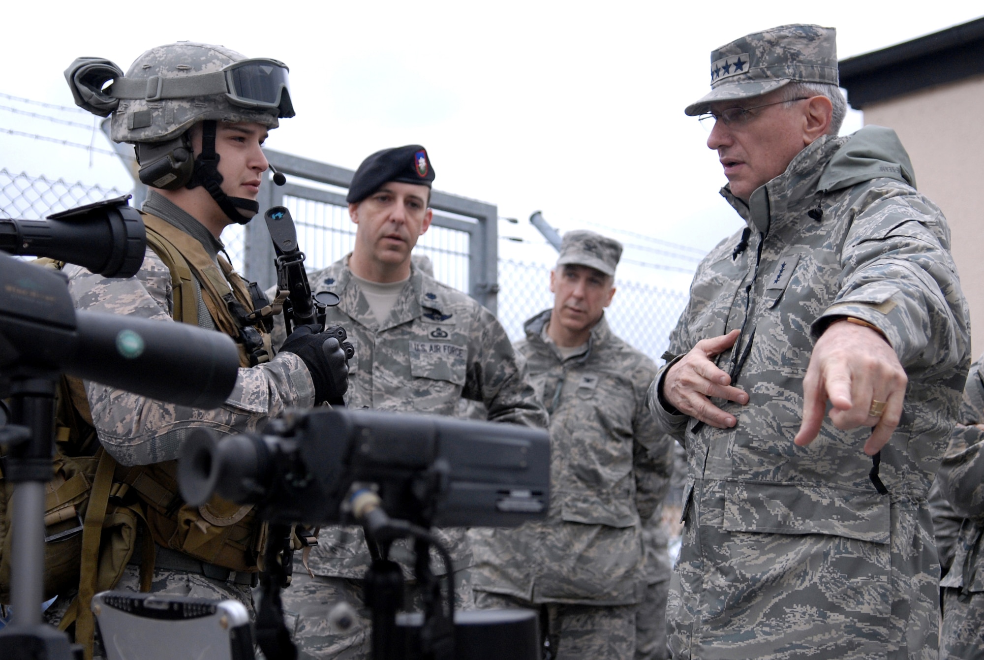Gen. Roger A. Brady, U.S. Air Forces in Europe commander, talks with Airman 1st Class Michael Kelley, a tactical air control party specialist, about the equipment he carries in the field.  General Brady was visiting the 4th Air Support Operations Group at Wiesbaden Army Air Field, Germany, March 16, 2010.  (U.S. Air Force photo/Capt. John Ross)