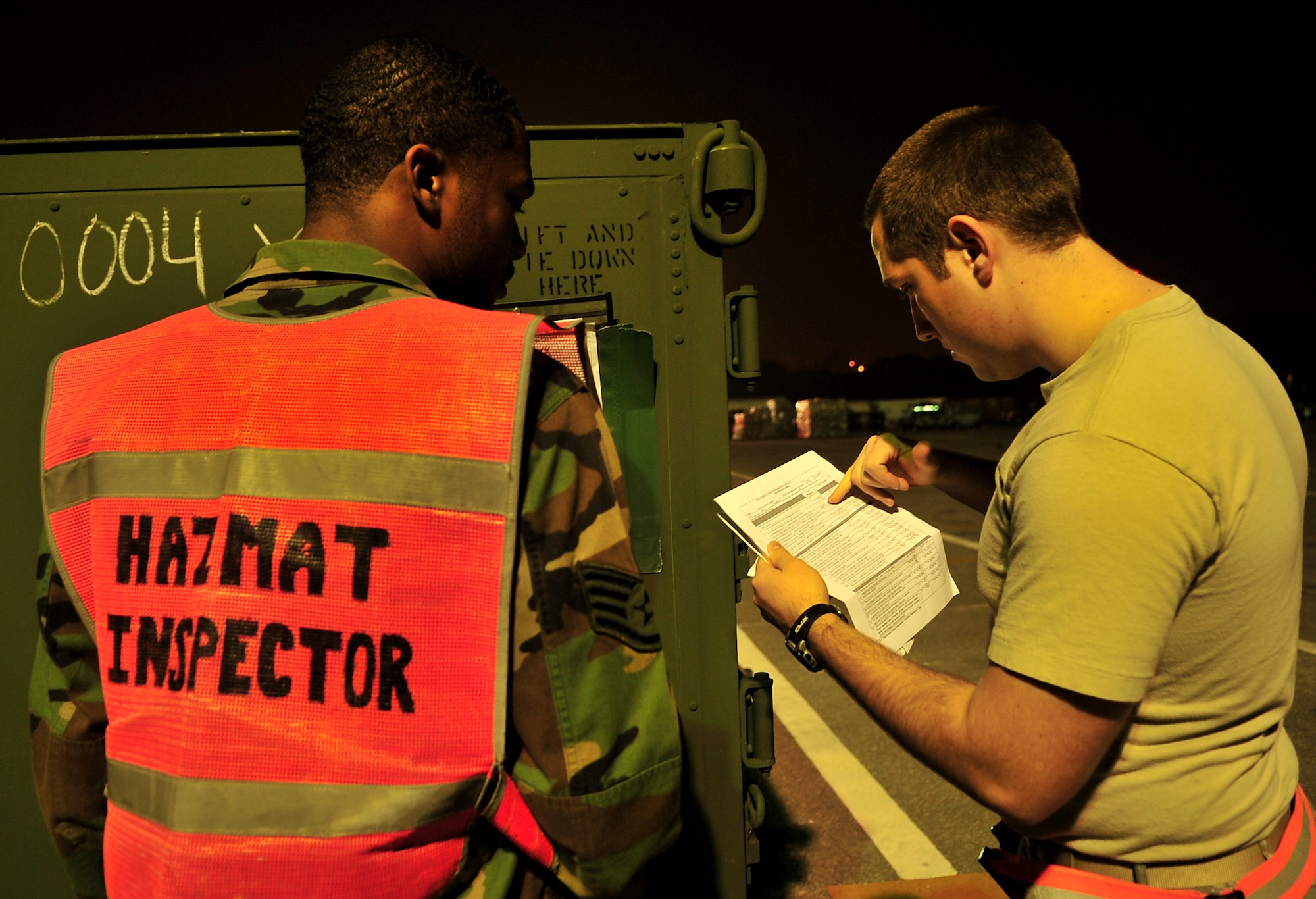 Staff Sgt. Emmanuel Griffin, 18th Logistics Readiness Squadron hazardous material inspector, checks for classification of the cargo before it is transported during Beverly High 10-02 at Kadena Air Base, Japan, March 22.  The 18th Wing is participating in a Local Operational Readiness Exercise March 22-26 to test the readiness of Kadena Airmen. (U.S. Air Force photo/Tech. Sgt. Rey Ramon)  