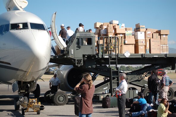 Airmen assigned to the 621st Contingency Response Wing from Joint Base McGuire-Dix-Lakehurst, N.J., assist with the hand-unloading of a civilian relief flight during Operation Unified Response at the Toussaint L’Ouverture International Airport, Port-au-Prince, Haiti, Jan. 21. The wing responded in the aftermath of a 7.0 magnitude earthquake that crumbled most of the surrounding area killing hundreds of thousands and displacing millions from their homes. (U.S. Air Force photo/Tech. Sgt. Matthew Loy)