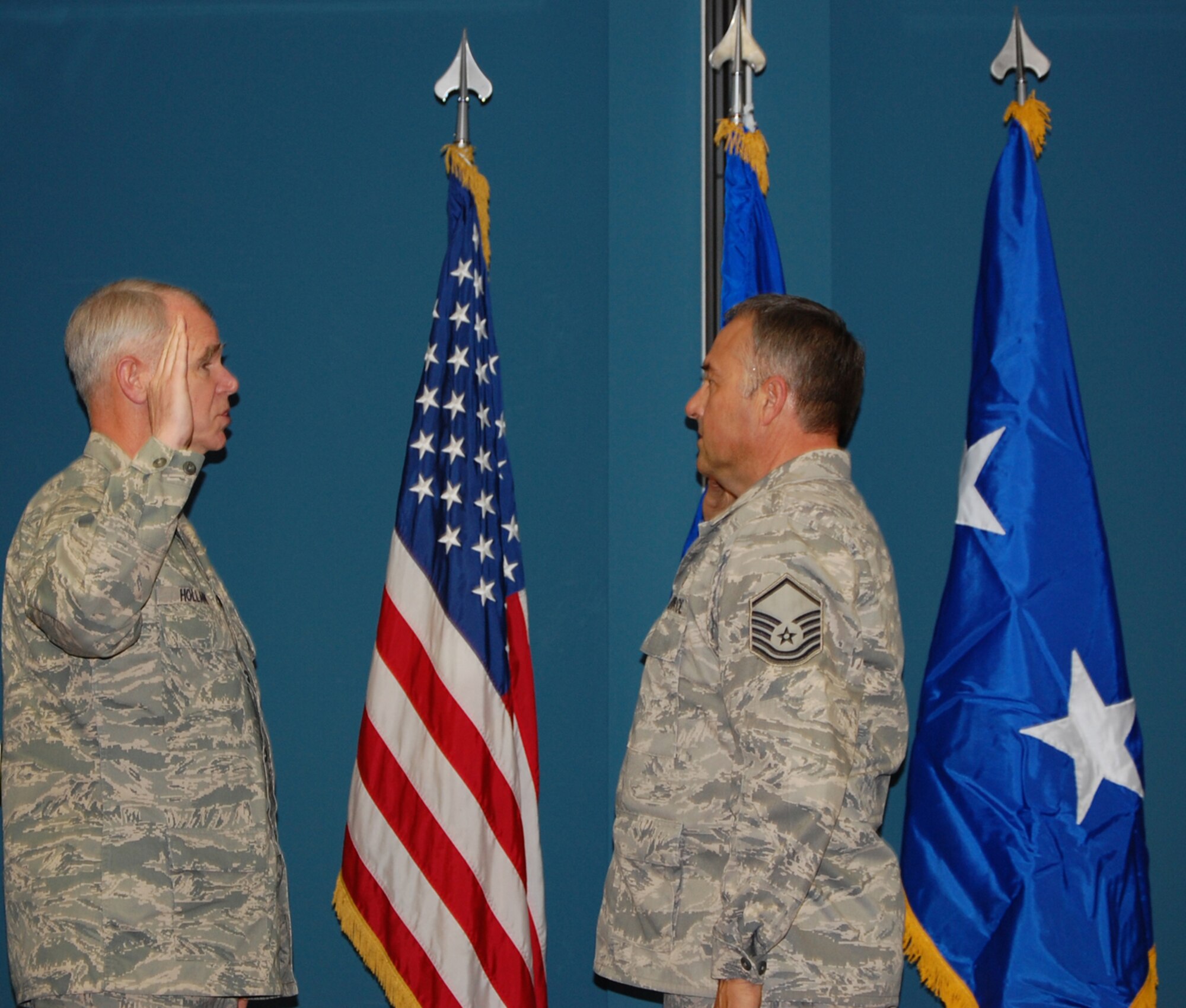 Master Sgt. Steve Hawley (right) re-enlists in the Air Force Reserve. (USAF photo by Ms. Donna Lea, 916ARW/PA)