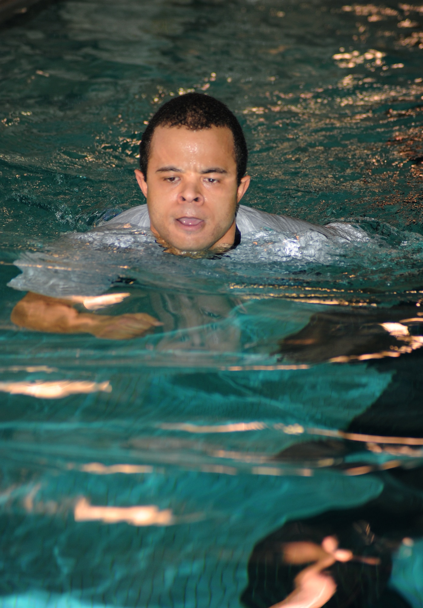 Staff Sgt. Marcus Young, 319th Maintenance Operations Squadron unit training manager, water jogs March 18 at the fitness center on Grand Forks Air Force Base, N.D.  Sergeant Young participated in the event, which was held to raise morale on base. (U.S. Air Force photo by Airman 1st Class Amber Price)
