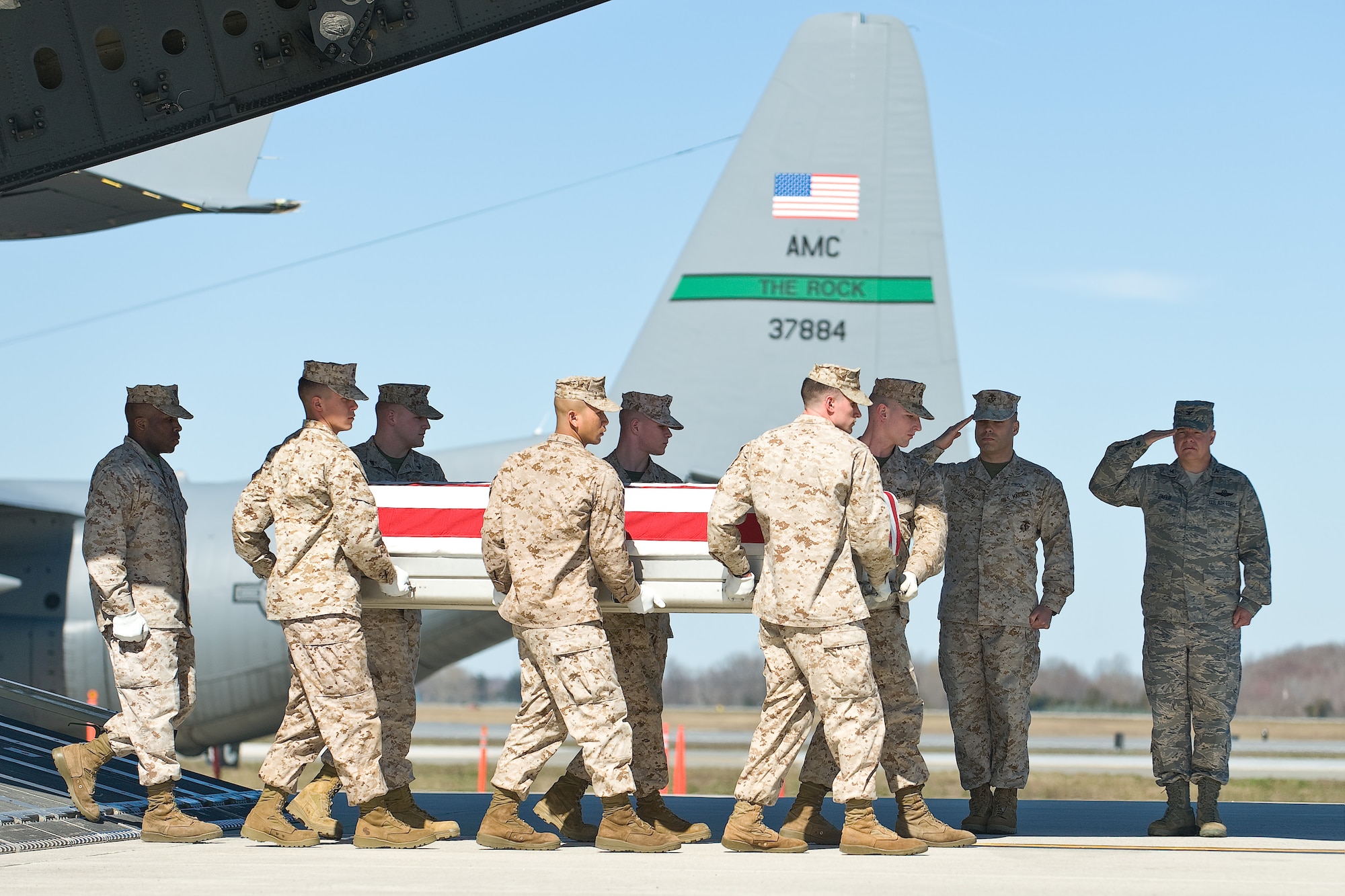 A U.S. Marine Corps team transfers the remains of Marine Corps Cpl. Jonathan D. Porto, of Largo, Fla., at Dover Air Force Base, Del., March 16. Porto was assigned to the 1st Battalion, 6th Marine Regiment, 2nd Marine Division, II Marine Expeditionary Force, Camp Lejeune, N.C. (U.S. Air Force photo/Roland Balik)
