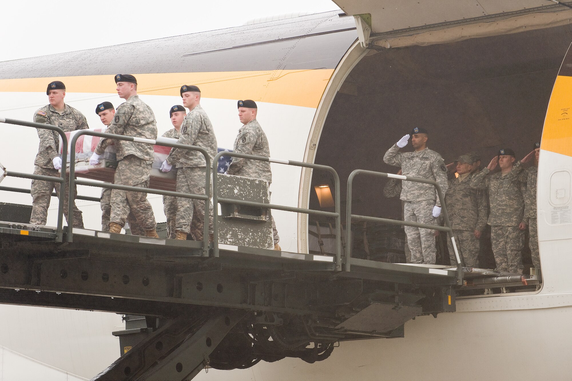 A U.S. Army carry team transfers the remains of Army Spc. Erin L. McLyman, of Federal Way, Wash., at Dover Air Force Base, Del., March 15.  (U.S. Air Force photo/Roland Balik)