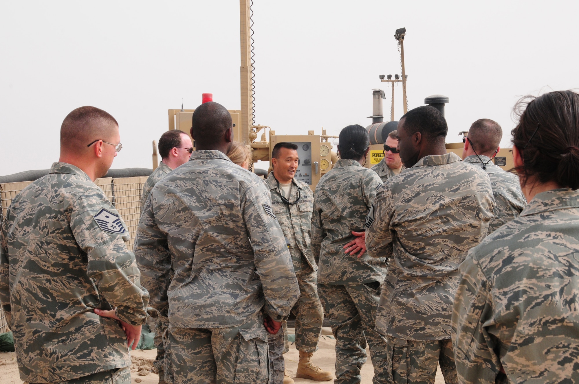 SOUTHWEST ASIA – U.S. Air Force Tech. Sgt. Terry Toulou, 386th Expeditionary Logistics Readiness Squadron Fuels Ramp/Storage section chief, explains the four elements (R-18, 19, 20, and 21) of the Fuels Operational Readiness Capability Equipment during an Open House March 21, 2010 hosted by the Fuels Management Flight here at an air base in Southwest Asia.  FORCE, which first came here in 2005, increases the flight’s issue, receipt and transfer capabilities with newer-design pumps, filters and servicing platforms. The system can optimally pump 900 gallons per minute.  (U.S. Air Force photo by Staff Sgt. Lakisha A. Croley/Released)