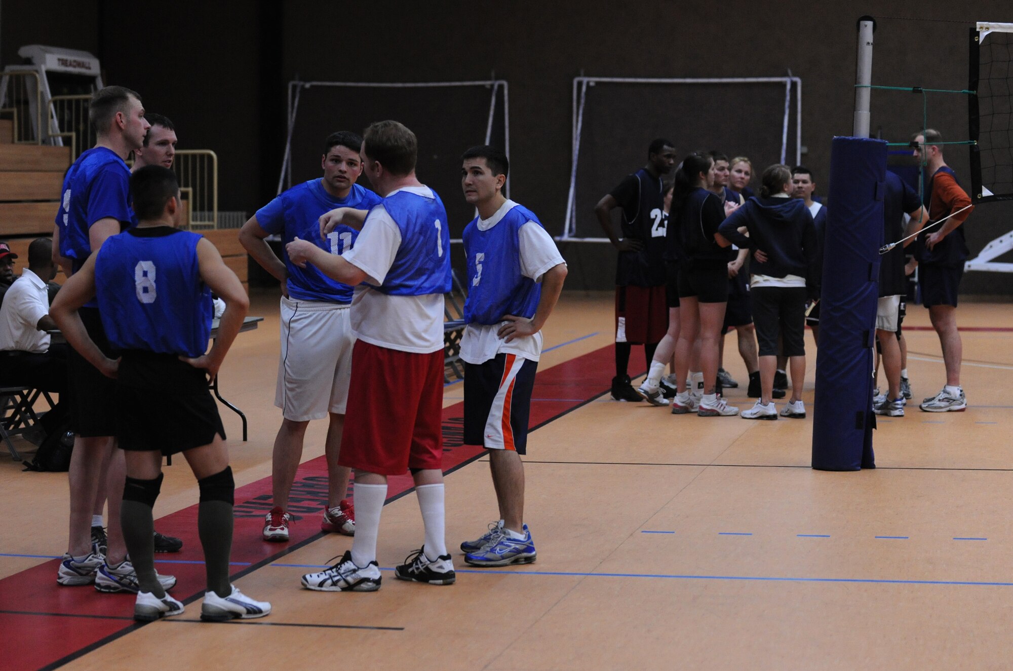 SPANGDAHLEM AIR BASE, Germany – Members of the 52nd Civil Engineer Squadron refocus their game plan during an intramural volleyball match at Skelton Memorial Fitness Center March 17. The 52nd CES defeated the 52nd Logistics Readiness Squadron by sweeping the match 2-0. (U.S. Air Force photo/Senior Airman Nathanael Callon)