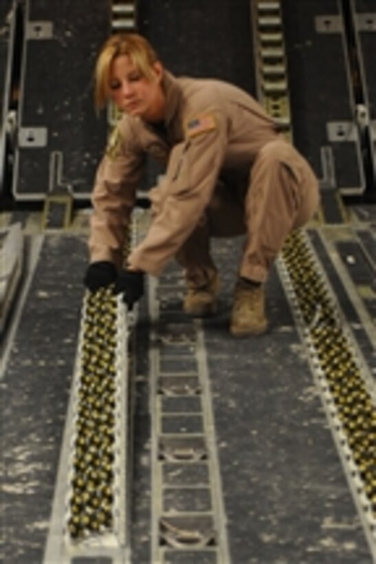 U.S. Air Force Senior Airman Spencer Keeley, an 816th Expeditionary Airlift Squadron loadmaster, prepares a C-17 Globemaster III aircraft to receive pallets at a Southwest Asia location on March 10, 2010.  Keeley is part of an all-female crew in honor of Women’s History Month.  