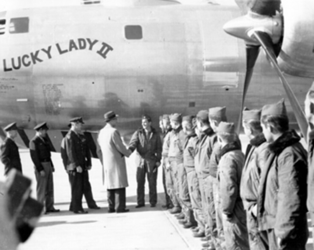 Lucky Lady II crew members are greeted by Air Secretary Stuart Symington and Gen. Hoyt Vandenberg following the first non-stop flight around the world.