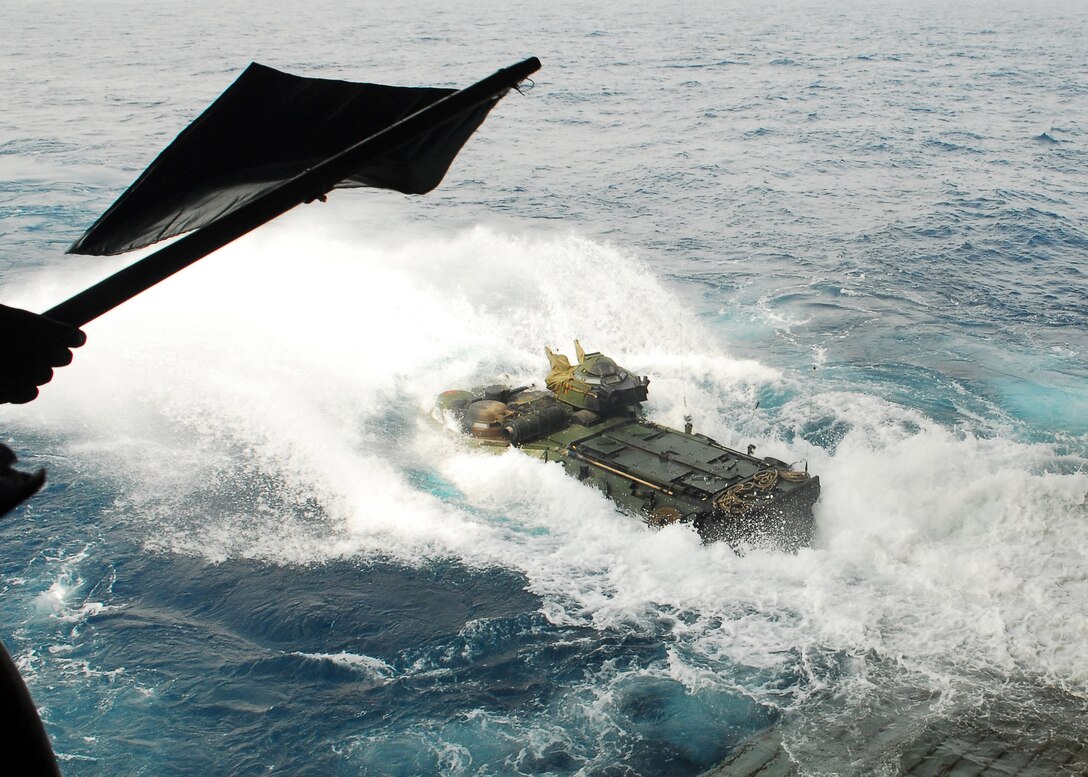 An amphibious assault vehicle (AAV) with the 31st Marine Expeditionary Unit (MEU) launches from the well deck of the forward-deployed amphibious assault ship USS Essex (LHD 2). The 31st MEU and Essex Amphibious Ready Group recently returned from its annual spring patrol of the Asia Pacific region.