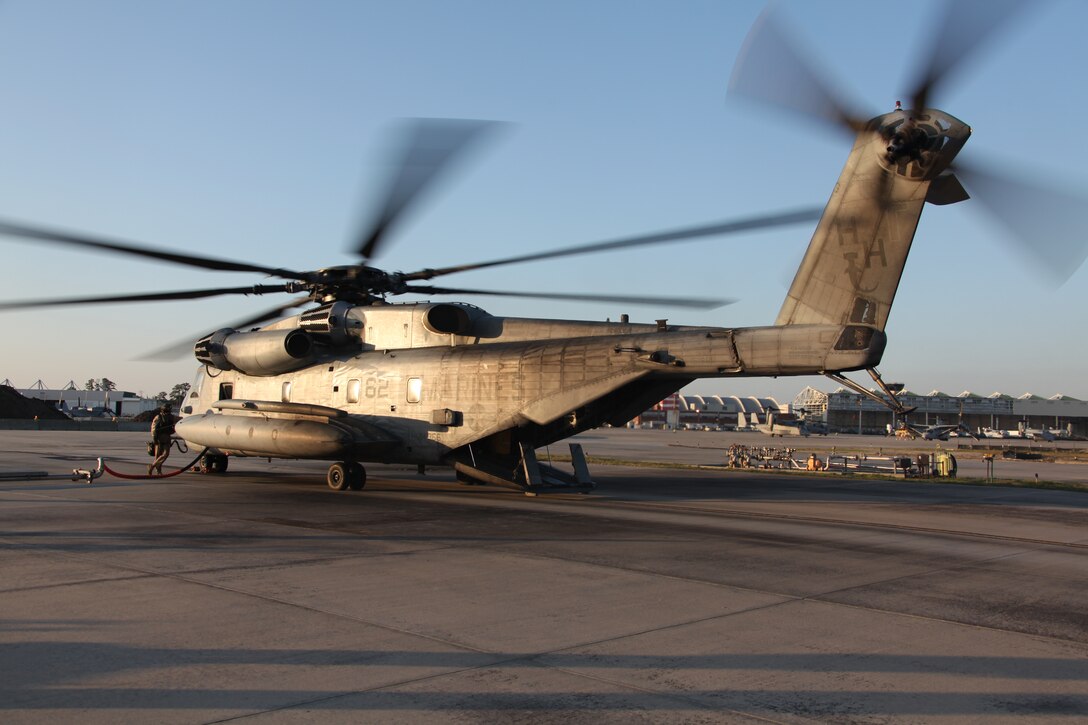 A Marine with Marine Heavy Helicopter Squadron 366 refuels a CH-53E Super Stallion following a training exercise, March 23. HMH-366 conducted training at Marine Corps Base Camp Lejeune, N.C., in order for  three of the squadron’s pilots to be certified for  external-lift flights.