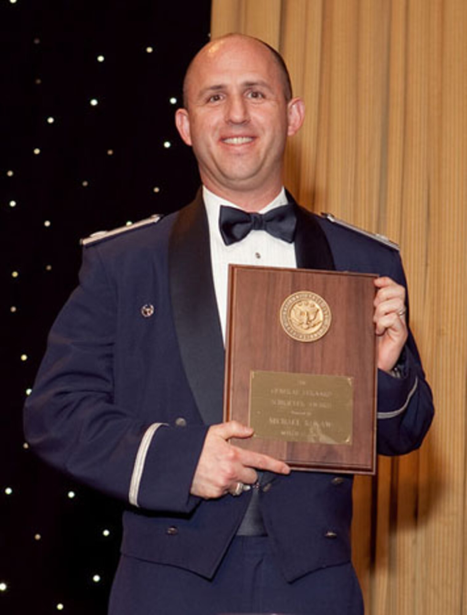 Lt. Col. Michael Rokaw, Advanced Capabilities Squadron commander, receives the National Space Club’s General Bernard Schriever Award for excellence in military space operations and acquisition. The award was presented at the club’s Goddard Dinner in Washington D.C., March 12. (Photo by Chris Burch, used by permission)