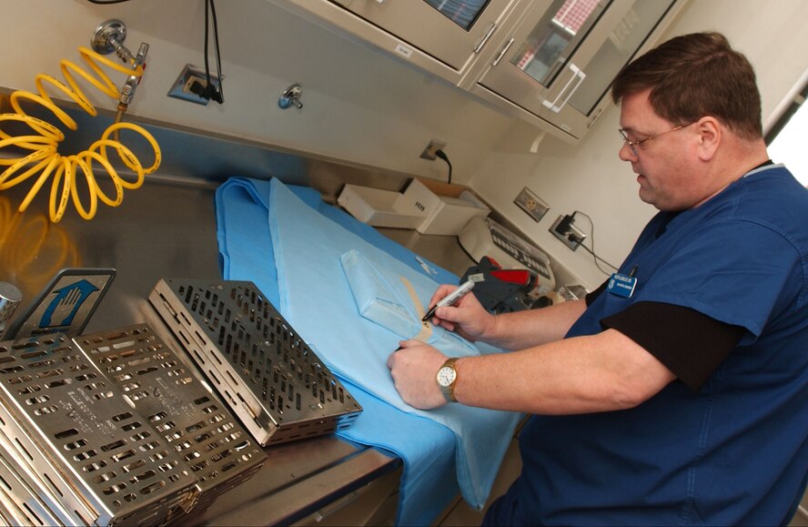 Dental technicians at the David Grant USAF Medical Center's Arthur J. Sachsel Dental Clinic work at crafting new dental implants for patients. (U.S. Air Force photo / SrA Lilliana E Moreno-Miranda)