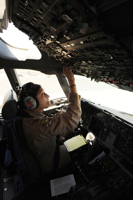 Capt. Angela Kimler, 816th Expeditionary Airlift Squadron pilot, conducts post-flight operations on a C-17 Globemaster III at an air base in Southwest Asia March 10, 2010. Captain Kimler was the aircraft commander during a flight with an all-female crew in honor of Women's History Month and is deployed from the 14th Airlift Squadron at Charleston Air Force Base, S.C. (U.S. Air Force photo/Senior Airman Kasey Zickmund)