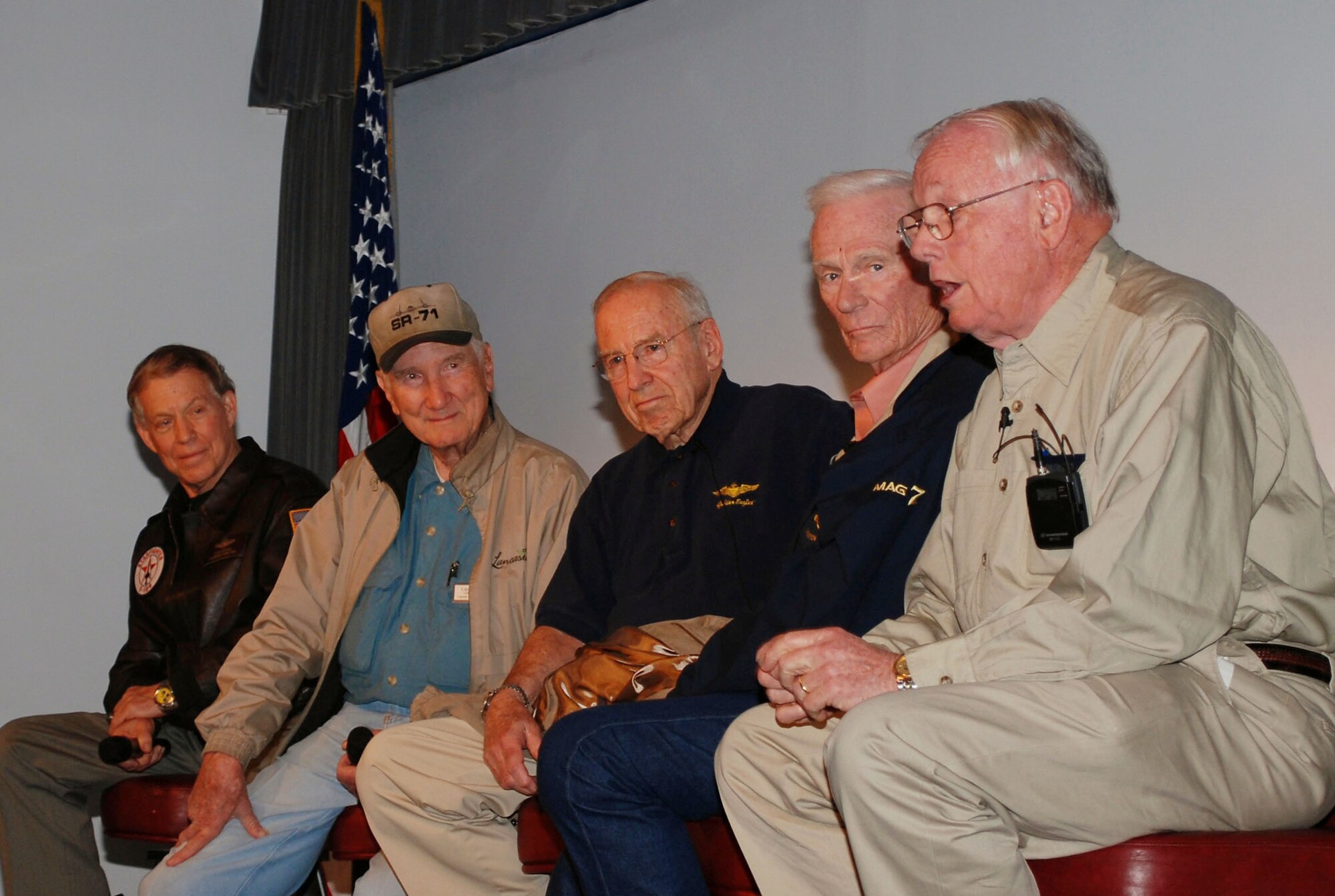Retired Brig. Gen. Steven Ritchie, Bob Gilliland, retired Navy Capt. Jim Lovell, retired Navy Capt. Gene Cernan and Neil Armstrong (left to right) address listeners at the NCO Academy auditorium March 5, 2010, during the first stop of the "Legends of Aerospace" tour at Ramstein Air Base, Germany.The astronauts and aviators, along with David Hartman, the original host of "Good Morning America," also visited the wounded warriors at Landstuhul Area Regional Medical Center. (U.S. Air Force photo/2nd Lt. Nicholas Mercurio) 