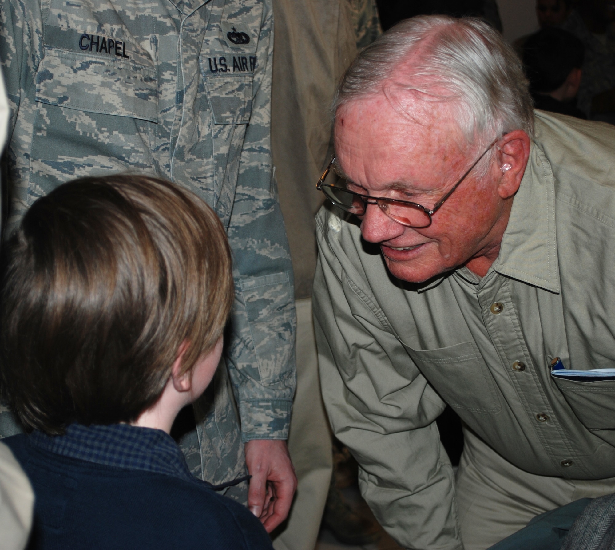 Jonathen Chapel, age 9, gets the chance to talk to his hero, Neil Armstrong, after the "Legends of Aerospace " tour visits the NCO Academy March 5, 2010, at Ramstein Air Base, Germany. Jonathen is the son of Tech. Sgt. Matt Chapel who is assigned to the NCO Academy. (U.S. Air Force photo/2nd Lt. Nicholas Mercurio)