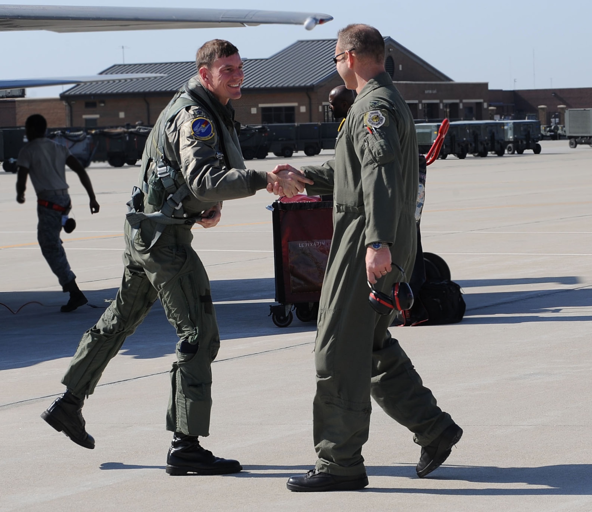 LANGLEY AIR FORCE BASE, Va. -- Lt. Col. Joel Cook, 71st Fighter Squadron commander, greets Col. Dirk Smith, 1st Operations Group commander, during his homecoming March 20. Ten F-15C Eagles from the 71st FS joined aircraft and personnel from five other bases to take part in a two week exercise called FANG Flag in Savannah, Ga. (U.S. Air Force photo/Airman Rebecca Montez)