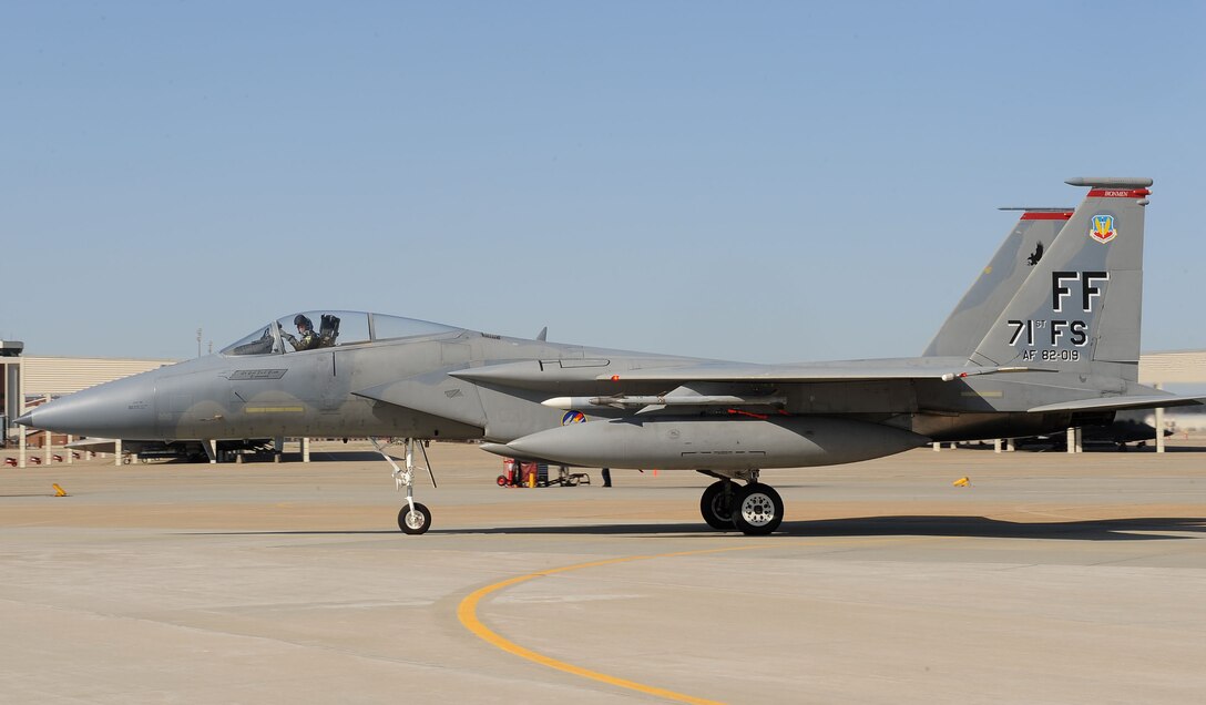LANGLEY AIR FORCE BASE, Va. -- Lt. Col. Joel Cook, 71st Fighter Squadron commander, returns home March 20 from a two week deployment in the 71st FS flagship. Ten F-15C Eagles from the 71st FS joined aircraft and personnel from five other bases to take part in a two week exercise called FANG Flag in Savannah, Ga. (U.S. Air Force photo/Airman Rebecca Montez)