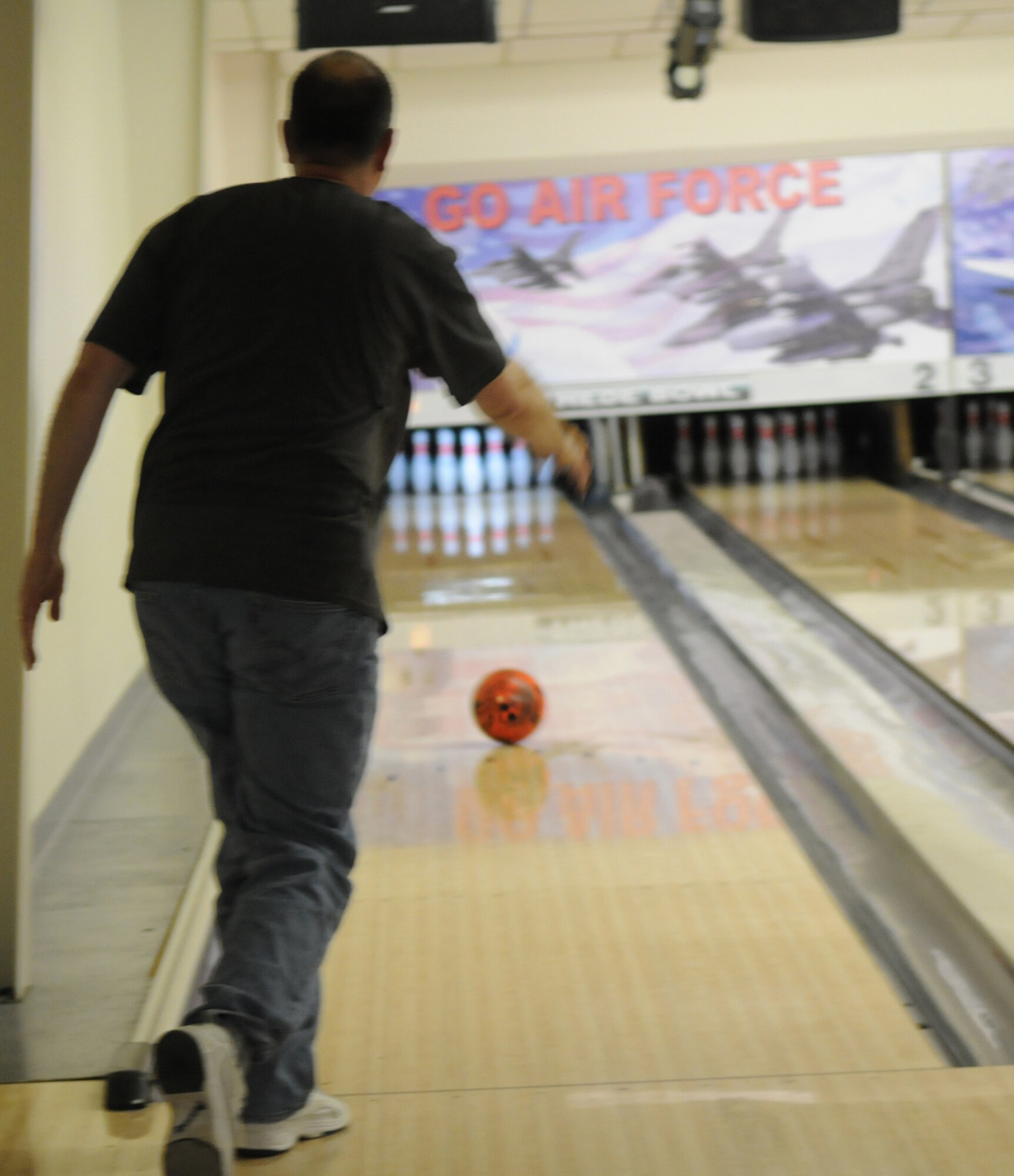 GOODFELLOW AIR FORCE BASE, Texas -- Col. David Rearick, 17th Training Wing vice commander, attempts to bowl a low score in the Low Ball Tourney, March 19, 2010.  Gutter balls counted as strikes, during the tourney, and the person with the lowest score won. (U. S. Air Force photo/Airman 1st Class Clayton Lenhardt)