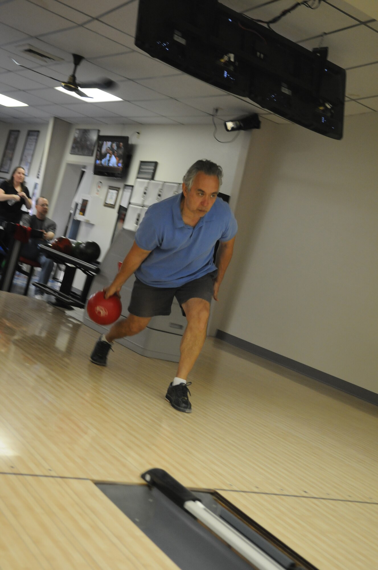 GOODFELLOW AIR FORCE BASE, Texas -- Retired Lt. Col. Bill Pope, attempts to bowl a low score in the Low Ball Tourney, March 19, 2010. Colonel Pope won the tourney with a score of 76, setting the standard for the next month. (U. S. Air Force photo/Airman 1st Class Clayton Lenhardt)