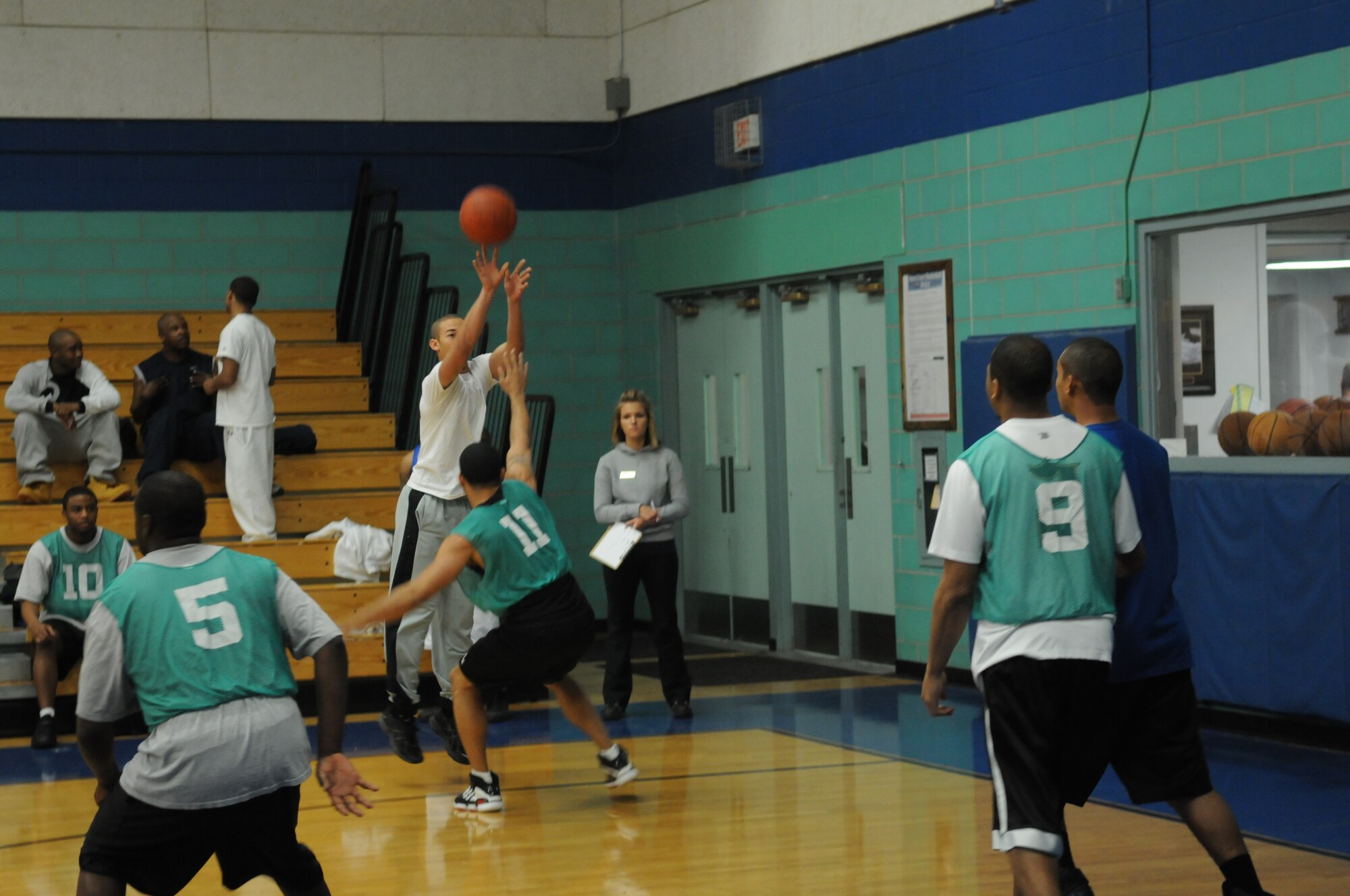GOODFELLOW AIR FORCE BASE, Texas -- Army Pvt. Greg Ray, 344th Military Intelligence Battalion, shoots as Tech. Sgt. Tim Harris, 316th Training Squadron, attempts to block during the bases 3 on 3 basketball tourney, March 20, 2010. (U. S. Air Force photo/Airman 1st Class Clayton Lenhardt)