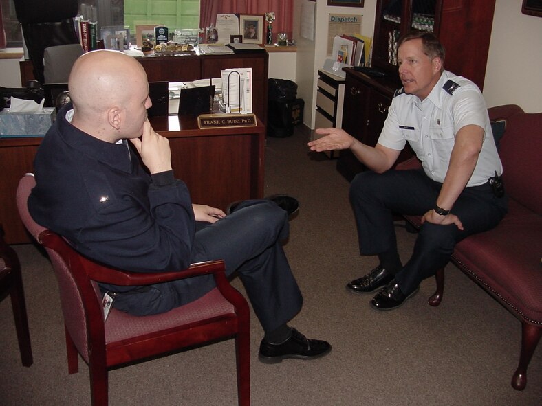 Col. (Dr.) Frank Budd, Mental Health flight commander at David Grant USAF Medical Center, consuls an individual as part of the Air Force-wide Traumatic Stress Response Team program. (U.S. Air Force photo / James Spellman, Jr.) 