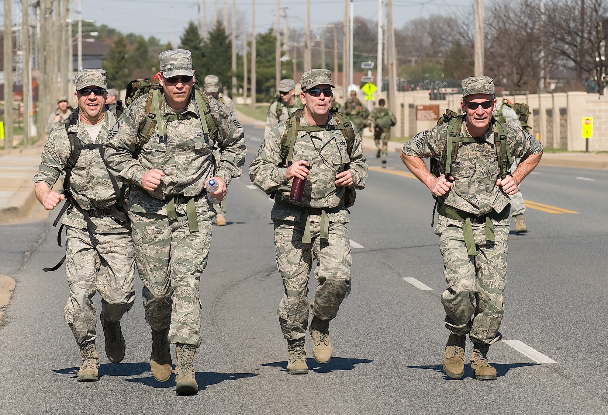 Chief Master Sgt. David Fish (left), Air Force Mortuary Affairs Operations Center enlisted manager, and Senior Master Sgt. James Segler (second from left), AFMAO superintendent, join other senior NCO's during the 436th Security Forces Squadron's 11th Annual Ruck March held March 20.participate in the 436th Security Forces Squadron's 11th Annual Ruck March held March 20. The annual 6.2 mile march is a fundraiser to honor the veterans of the Korean War who fought in the Battle of the Chosin Reservoir. (U.S. Air Force photo/Jason Minto)