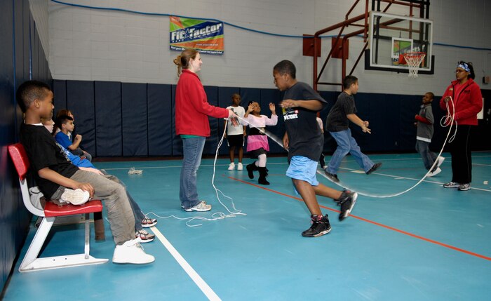 Children compete in the Lemon-Lime jump rope competition on Joint Base Charleston, S.C., March 22, 2010, held between the Air Force and Navy youth centers. The game is a process of elimination, involving a continuous stream of children through the rope. The competition is the second to be hosted by the Youth Programs Center here. (U.S. Air Force Photo/Airman 1st Class Lauren Main)