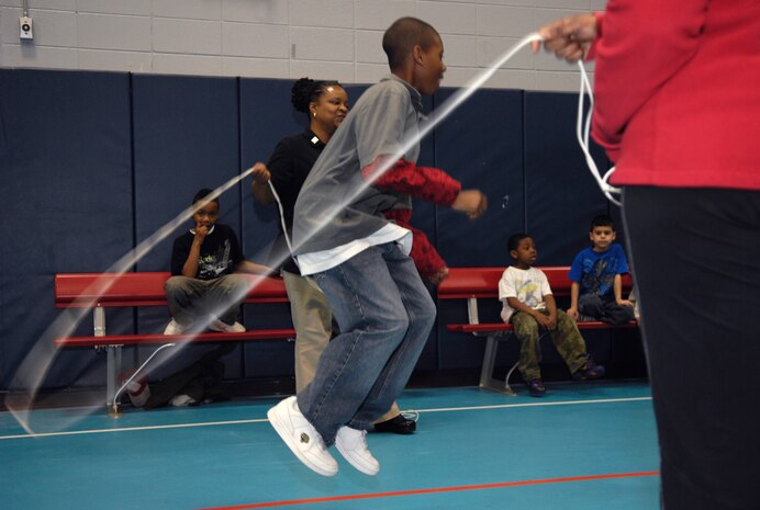 Nicholas Tolbert participates in the Youth Programs Center's second jump rope competition on Joint Base Charleston, S.C., March 22, 2010, between the Navy and Air Force youth centers. The competition, named Lemon-Lime, requires a line of children to file through and jump in without breaking the cycle. If a child jumps in and touches the rope, he or she is out. Nicholas is the son of retired Chief Petty Officer Eugene Tolbert. (U.S. Air Force Photo/Airman 1st Class Lauren Main)